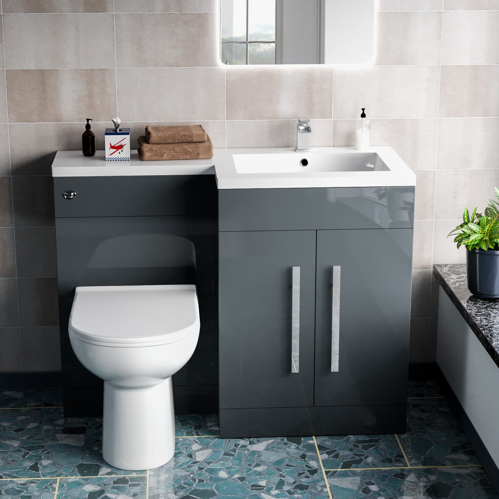 Bathroom setup with gray vanity unit, white toilet, and sink