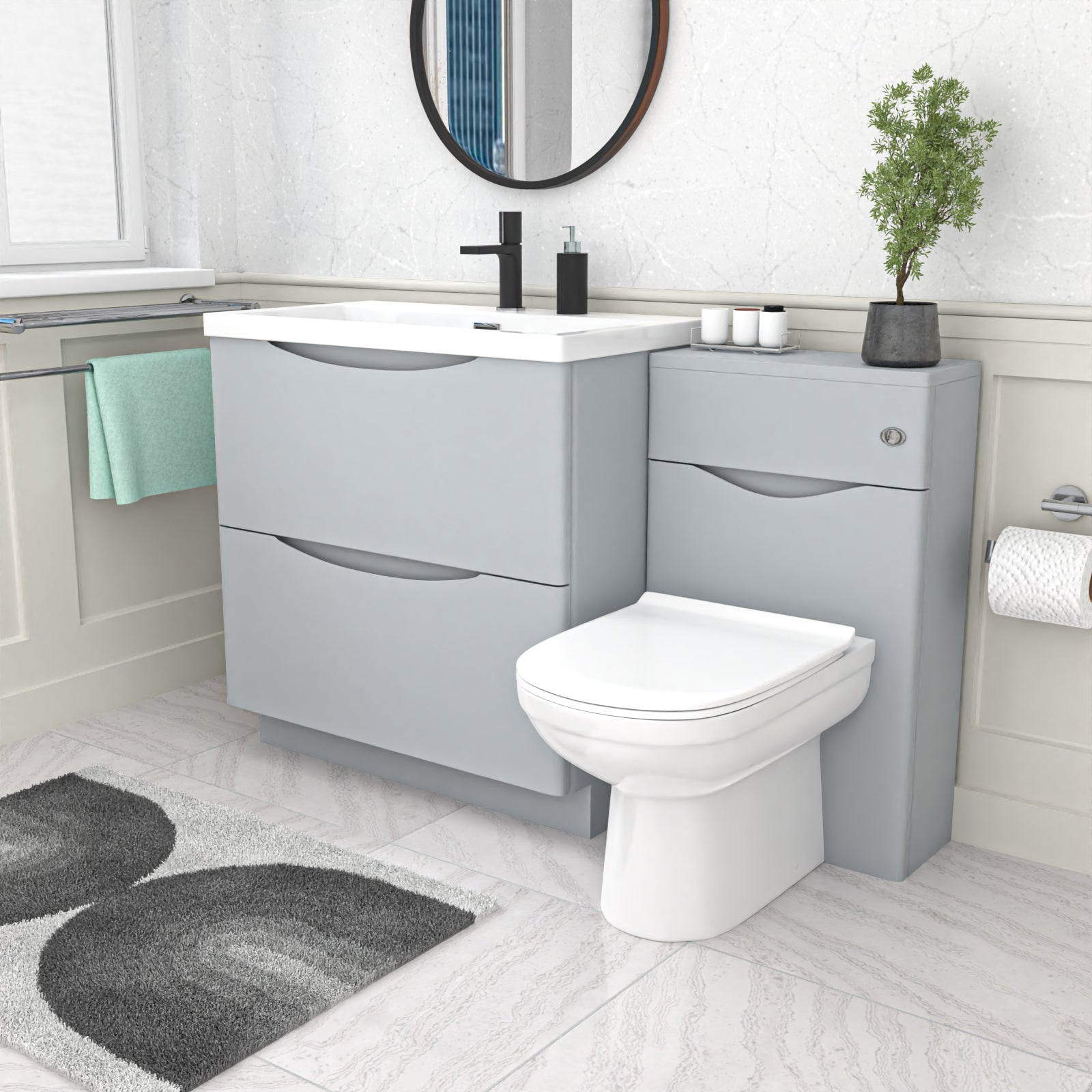 Bathroom setup with gray vanity unit, white toilet, and sink.