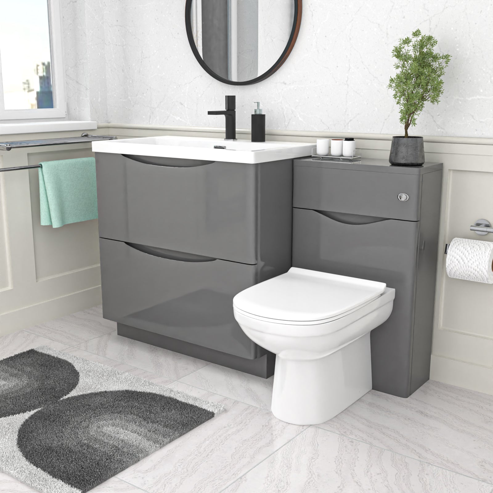 Bathroom setup with gray vanity unit, white toilet, and sink.