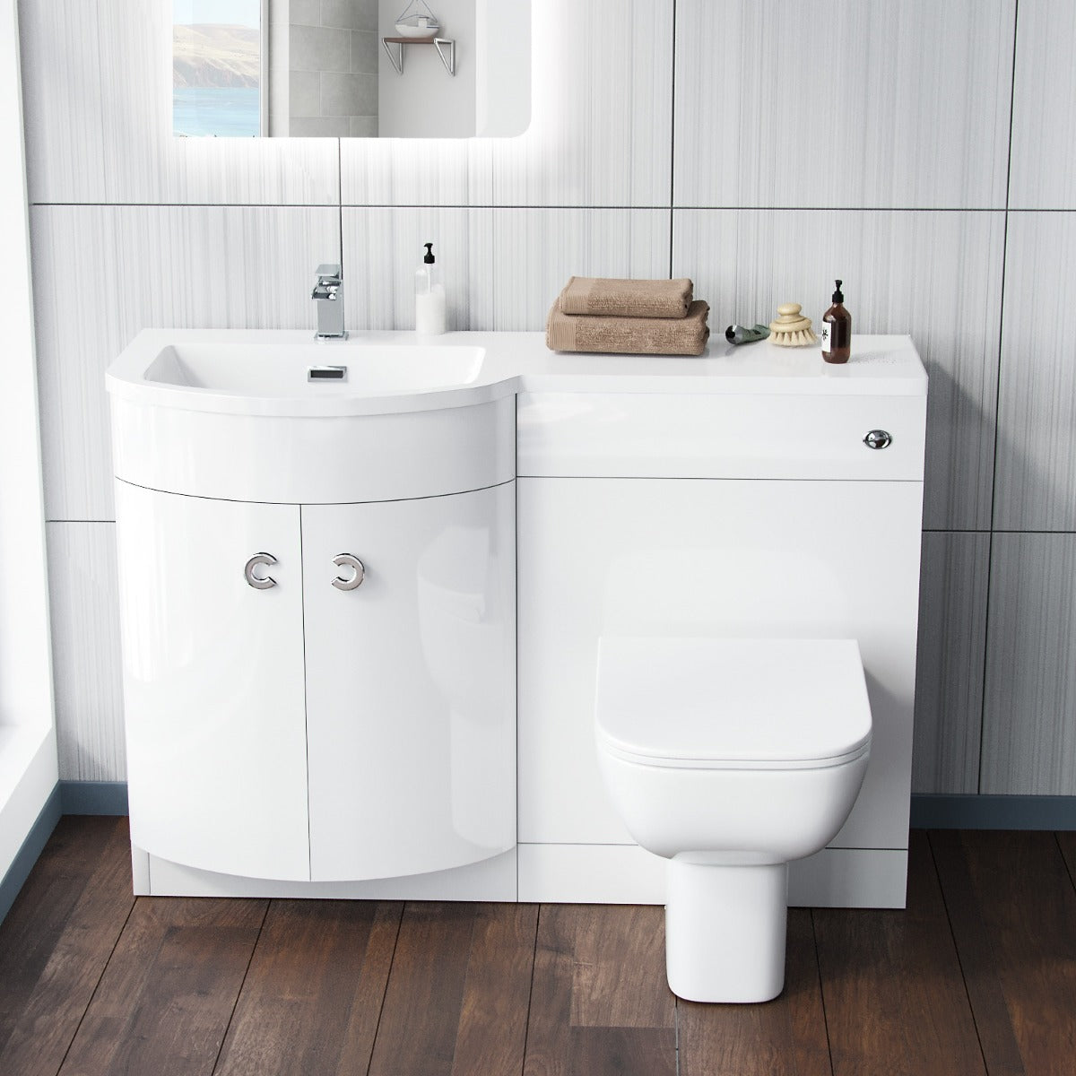 Bathroom setup with white vanity unit, sink, and toilet