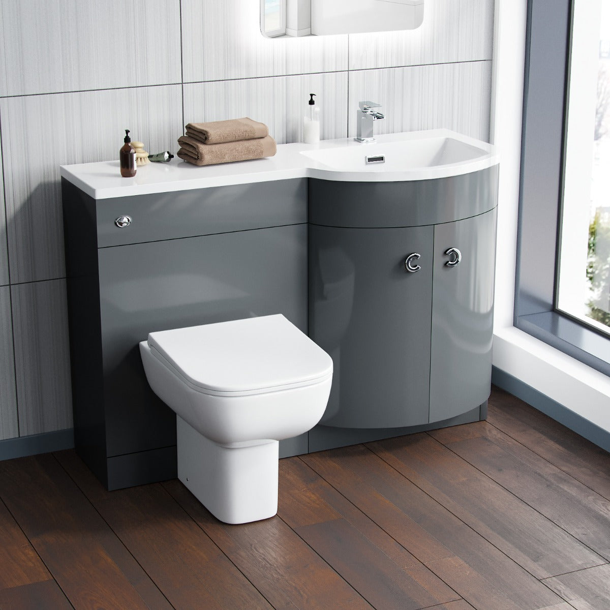 Bathroom setup with gray vanity unit, white toilet, and sink