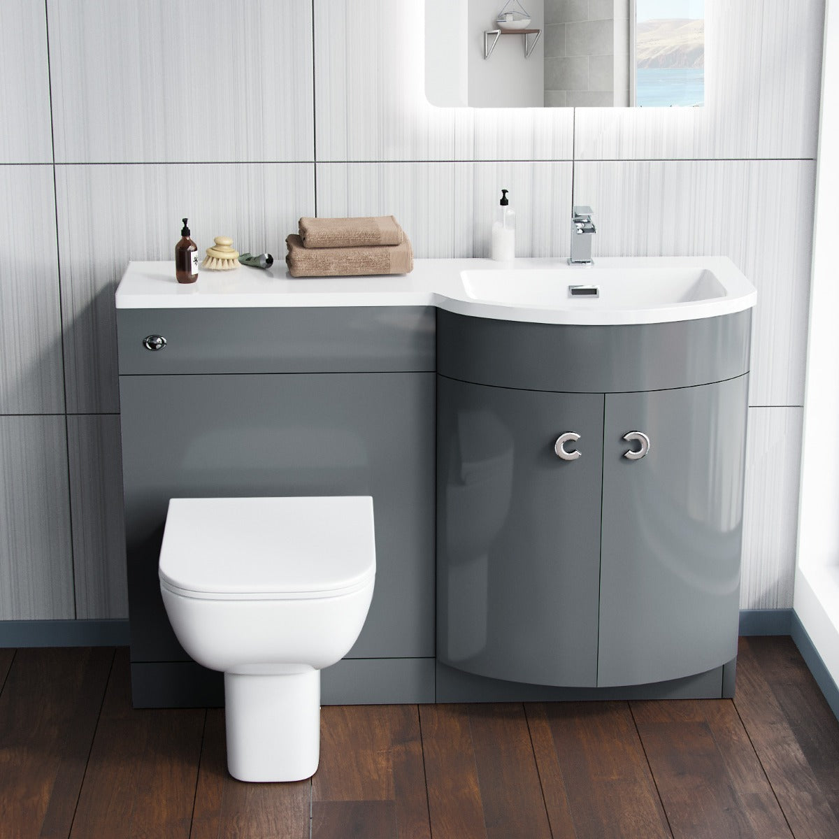 Bathroom setup with gray vanity unit, white toilet, and sink