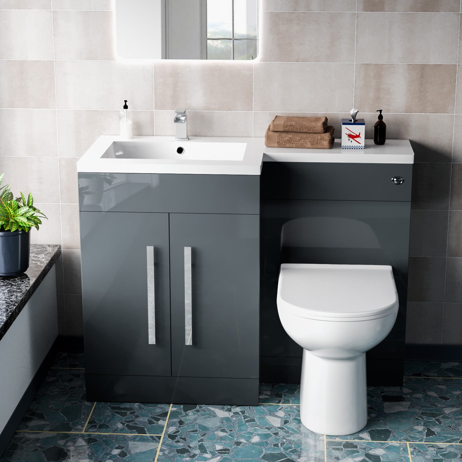Bathroom setup with gray vanity unit, white sink, and toilet 