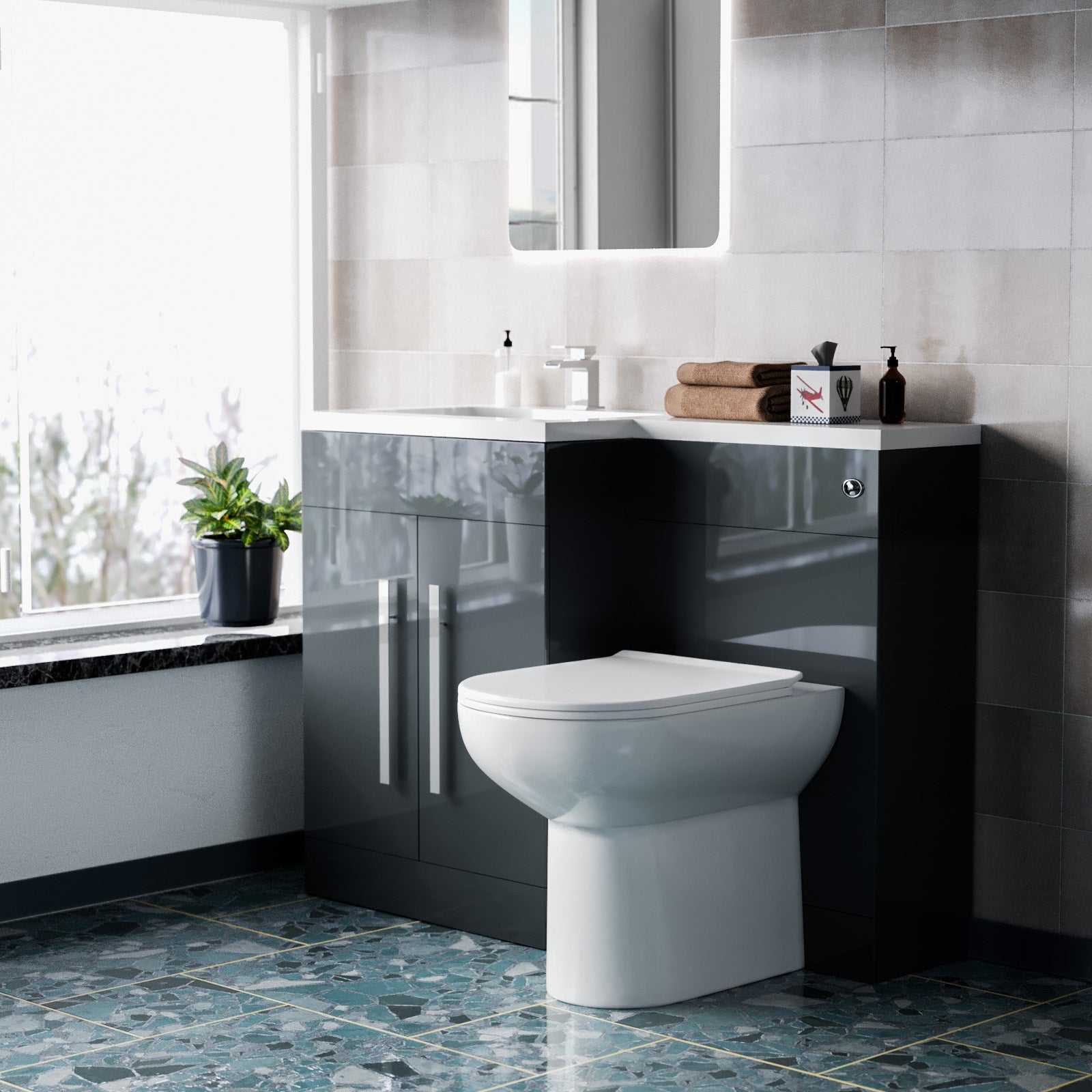 Modern bathroom with a toilet and vanity unit.