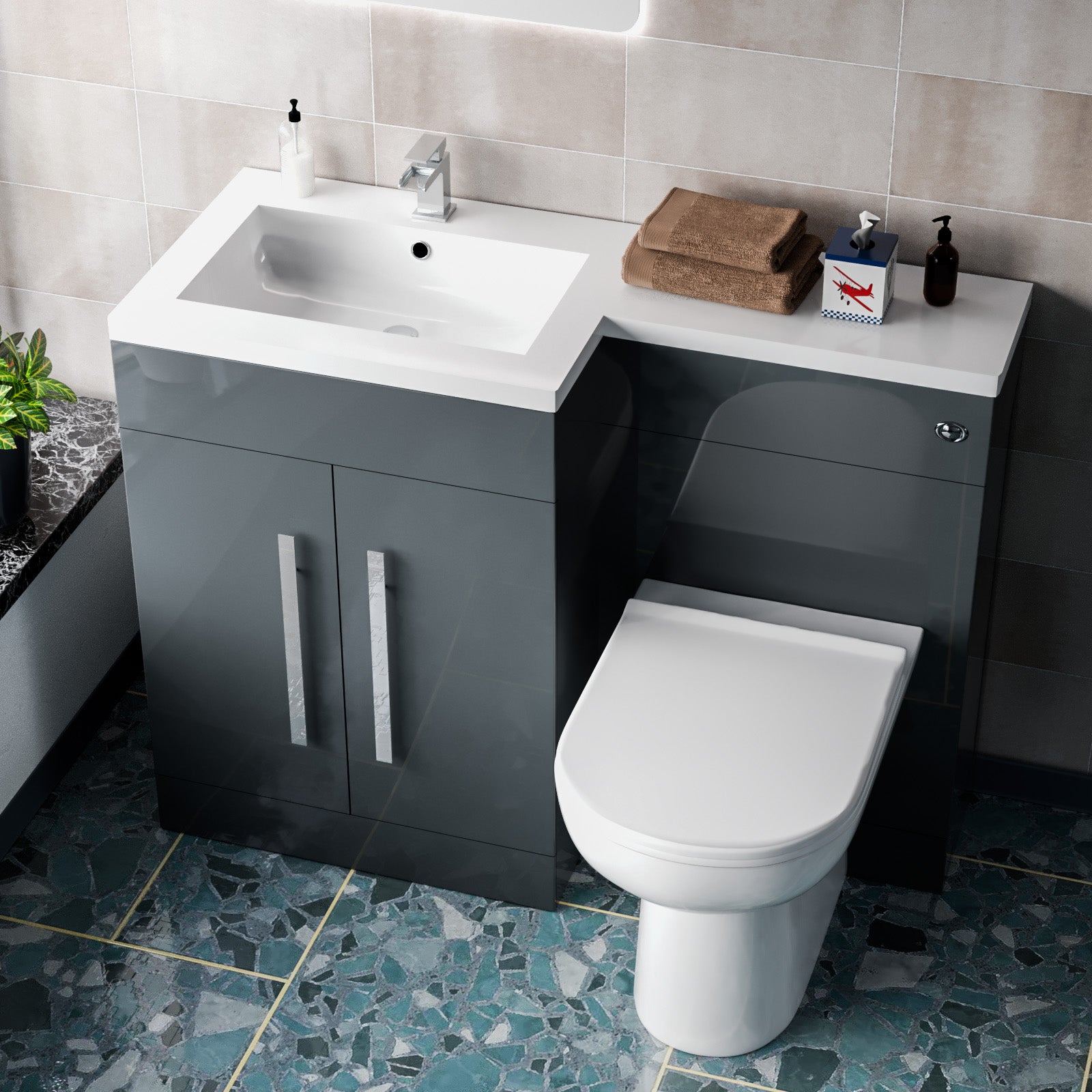 Bathroom setup with gray vanity unit, white sink, and toilet 
