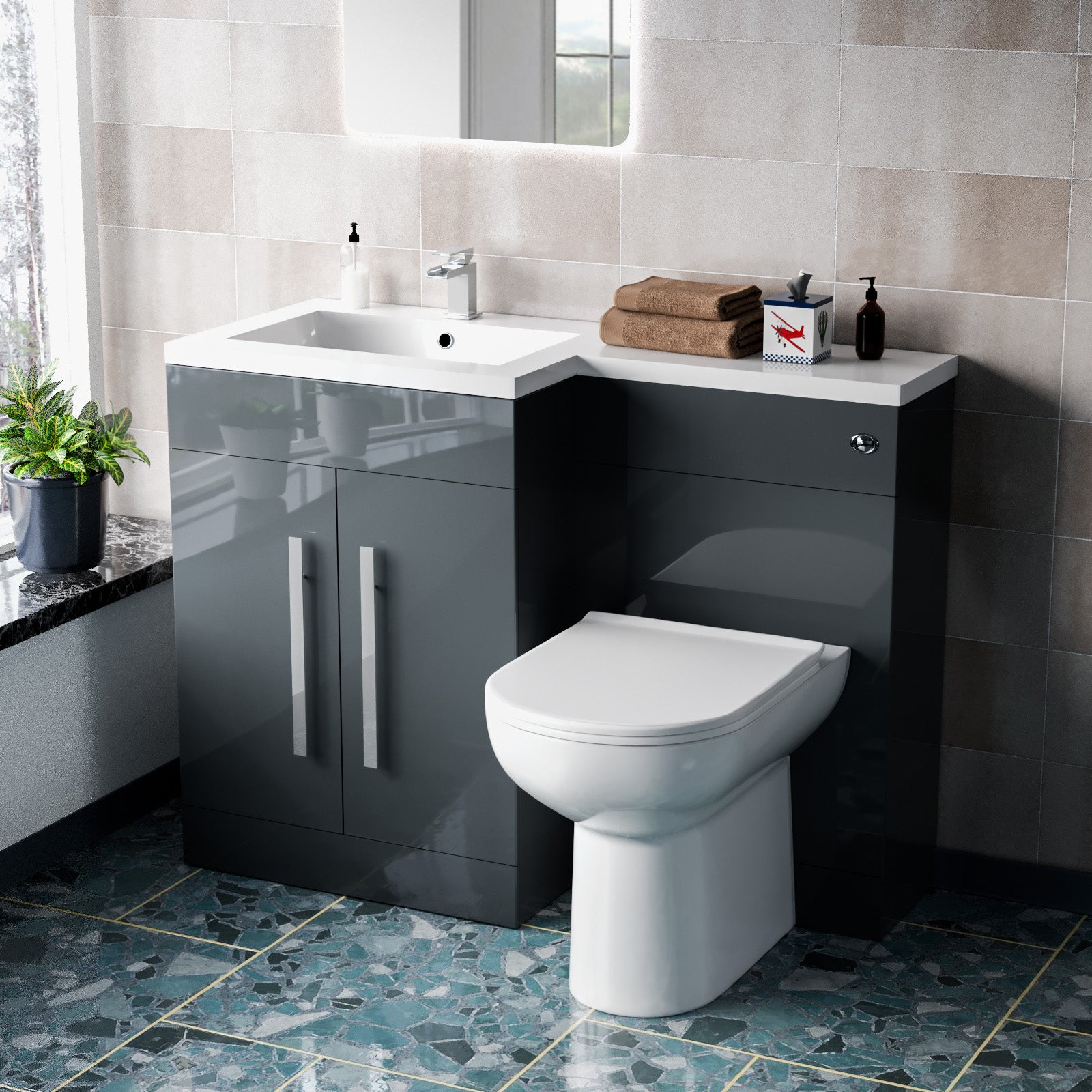 Bathroom setup with a black vanity unit, white sink, and toilet.