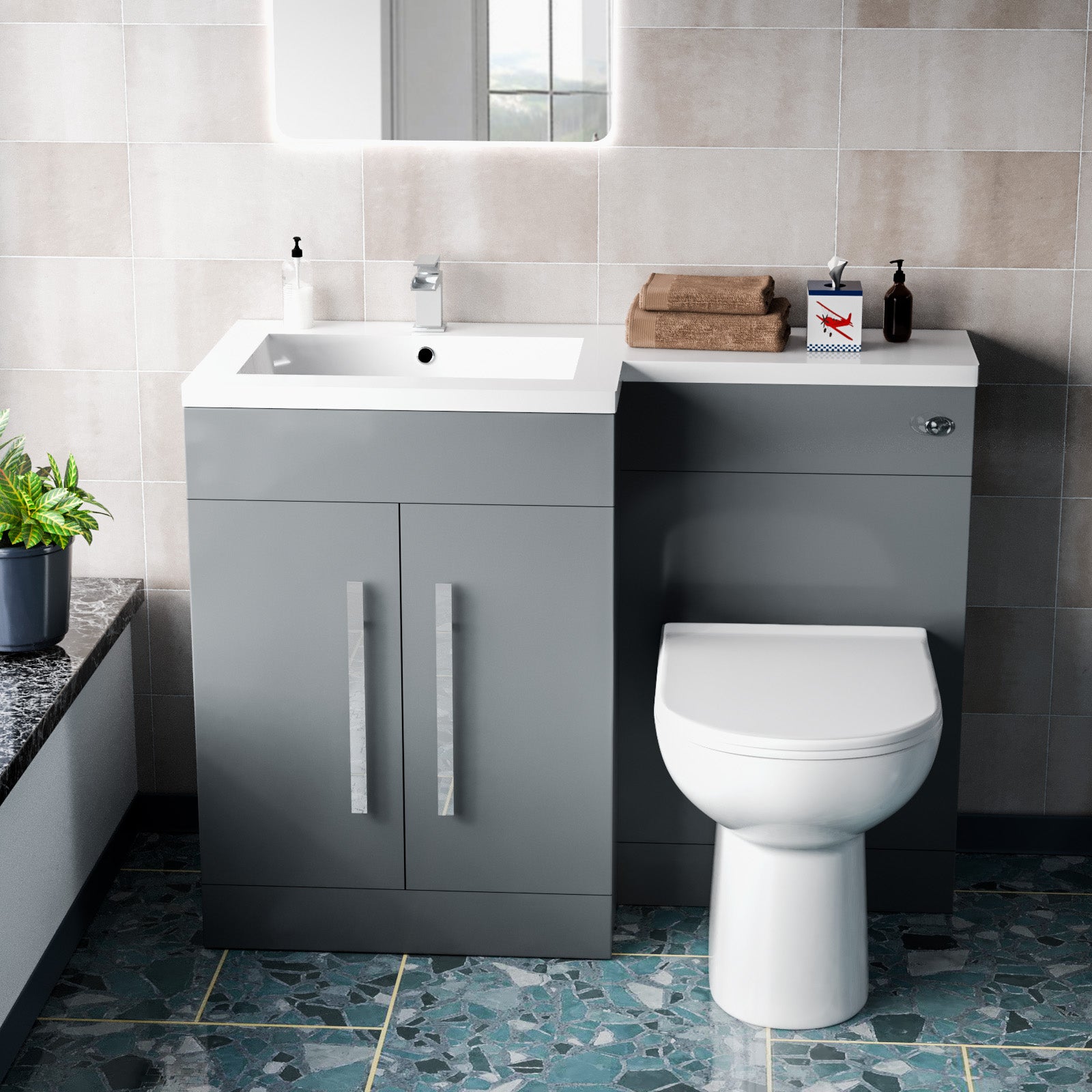 Bathroom setup with gray vanity unit, white sink, and toilet 