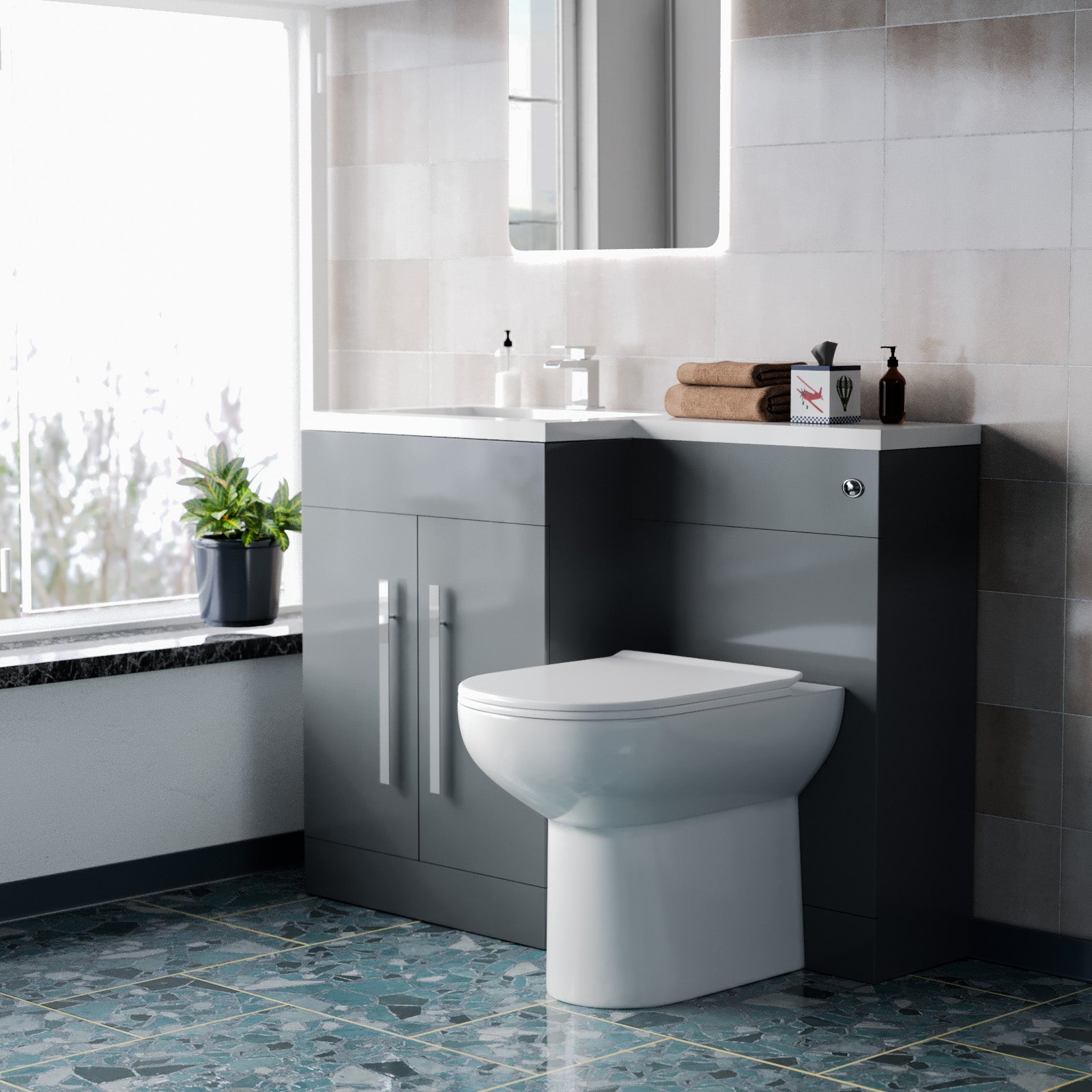 Modern bathroom with a toilet and gray cabinets.