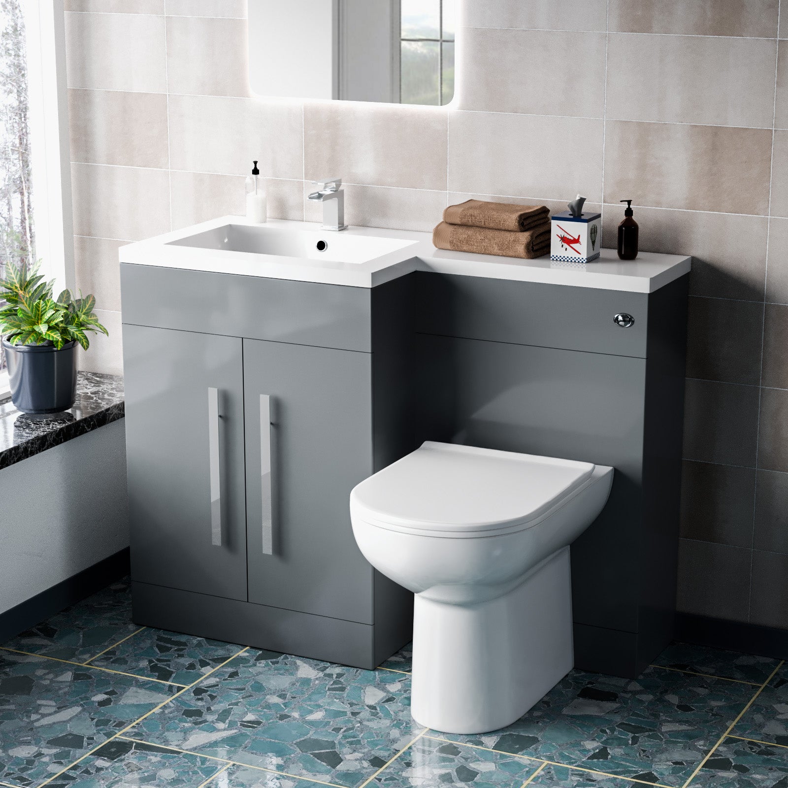 Bathroom setup with gray vanity unit, white sink, and toilet 