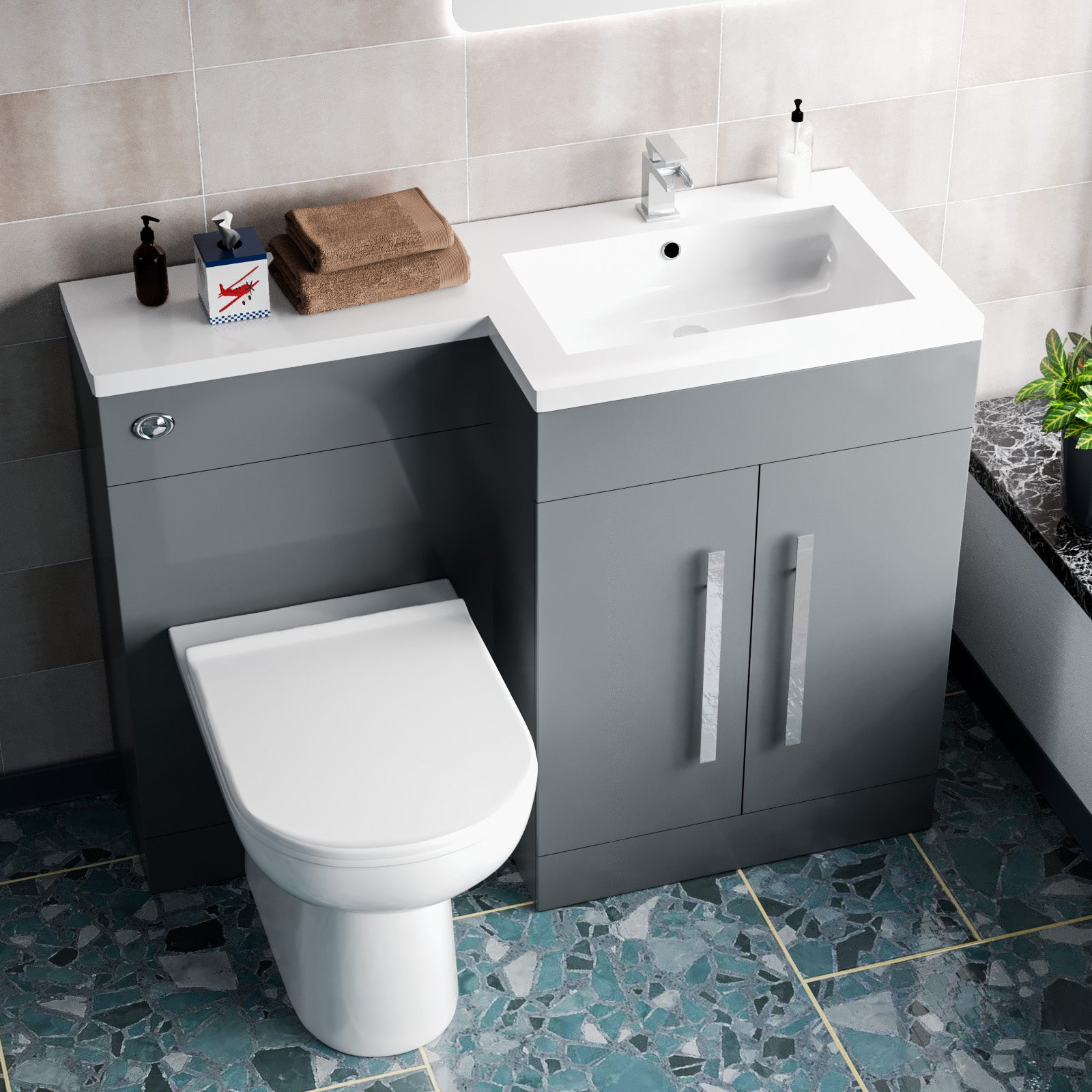 Bathroom setup with gray vanity unit, white toilet, and sink.