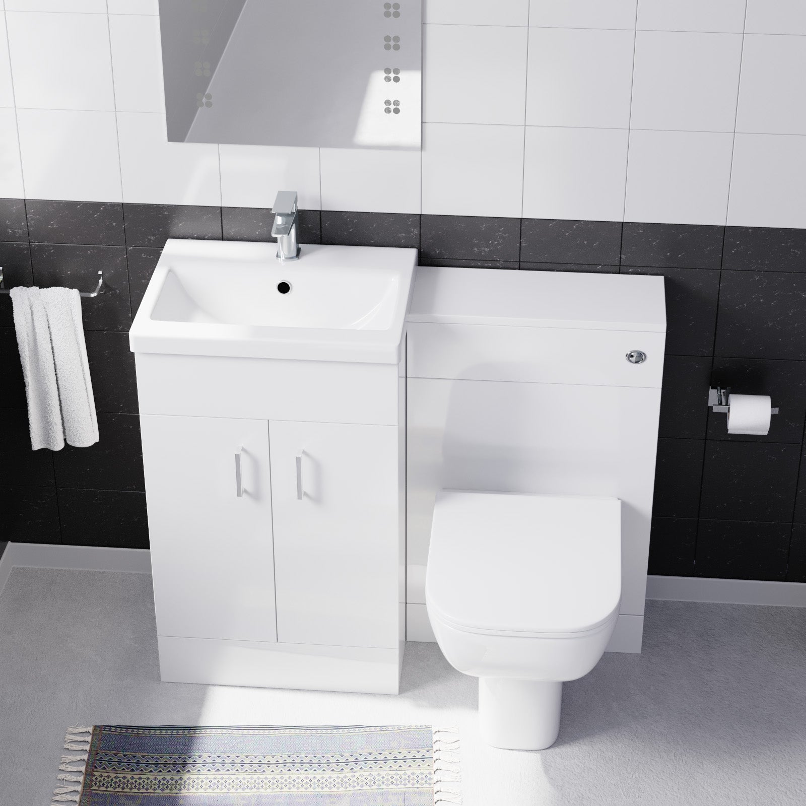 Bathroom setup with white vanity unit and toilet 