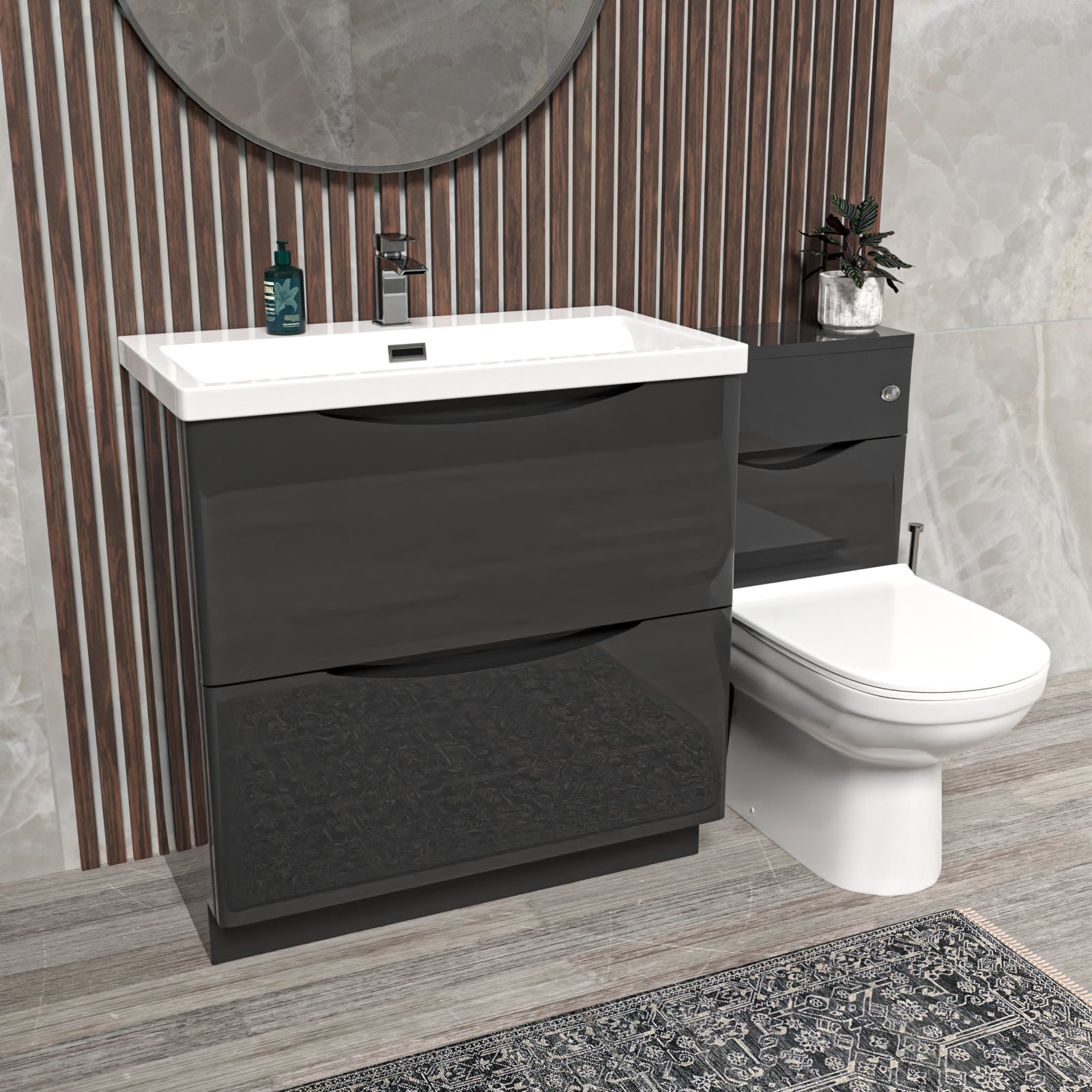 Bathroom setup with dark gray vanity unit, white sink, and toilet 