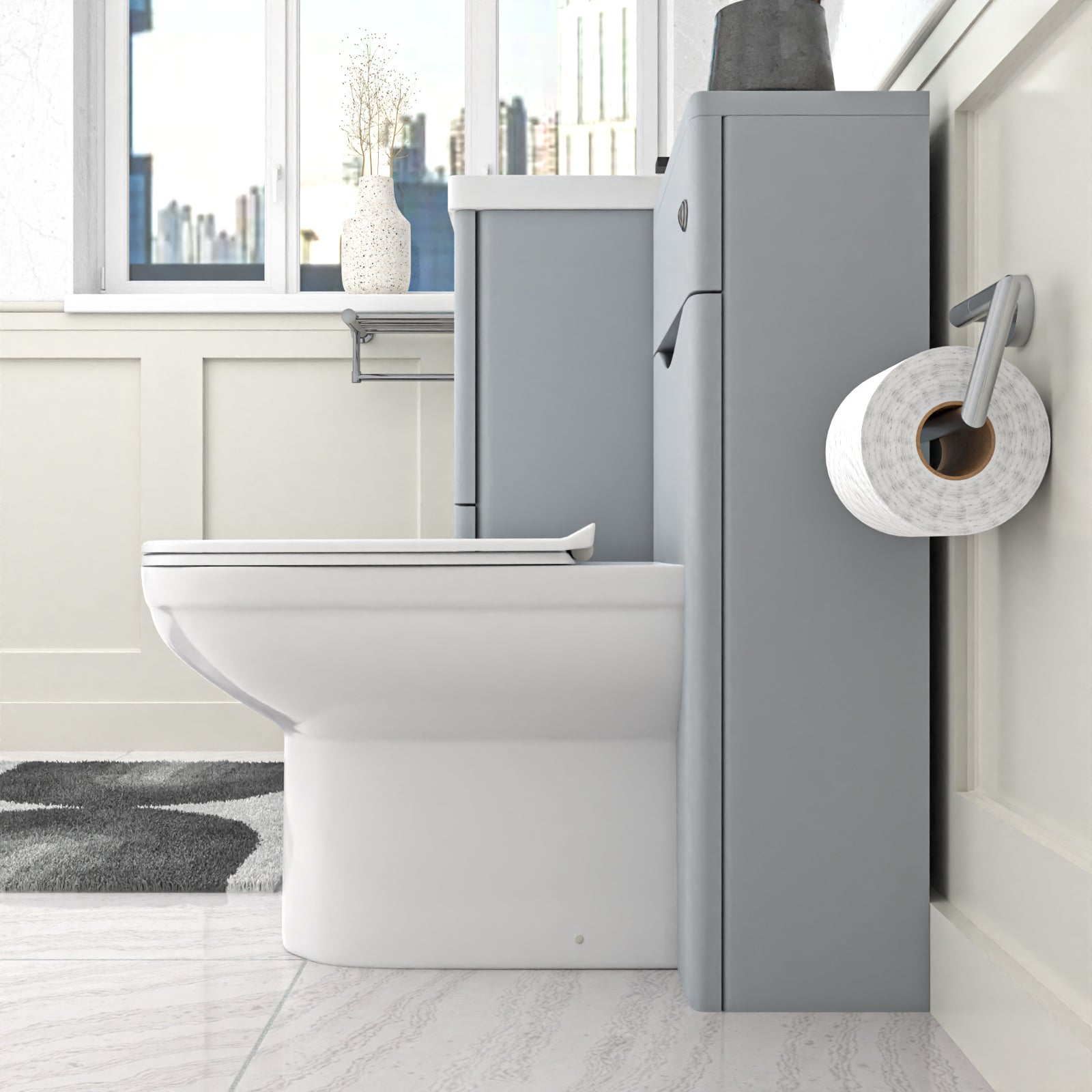 Bathroom setup with a toilet and a gray wall-mounted cabinet.