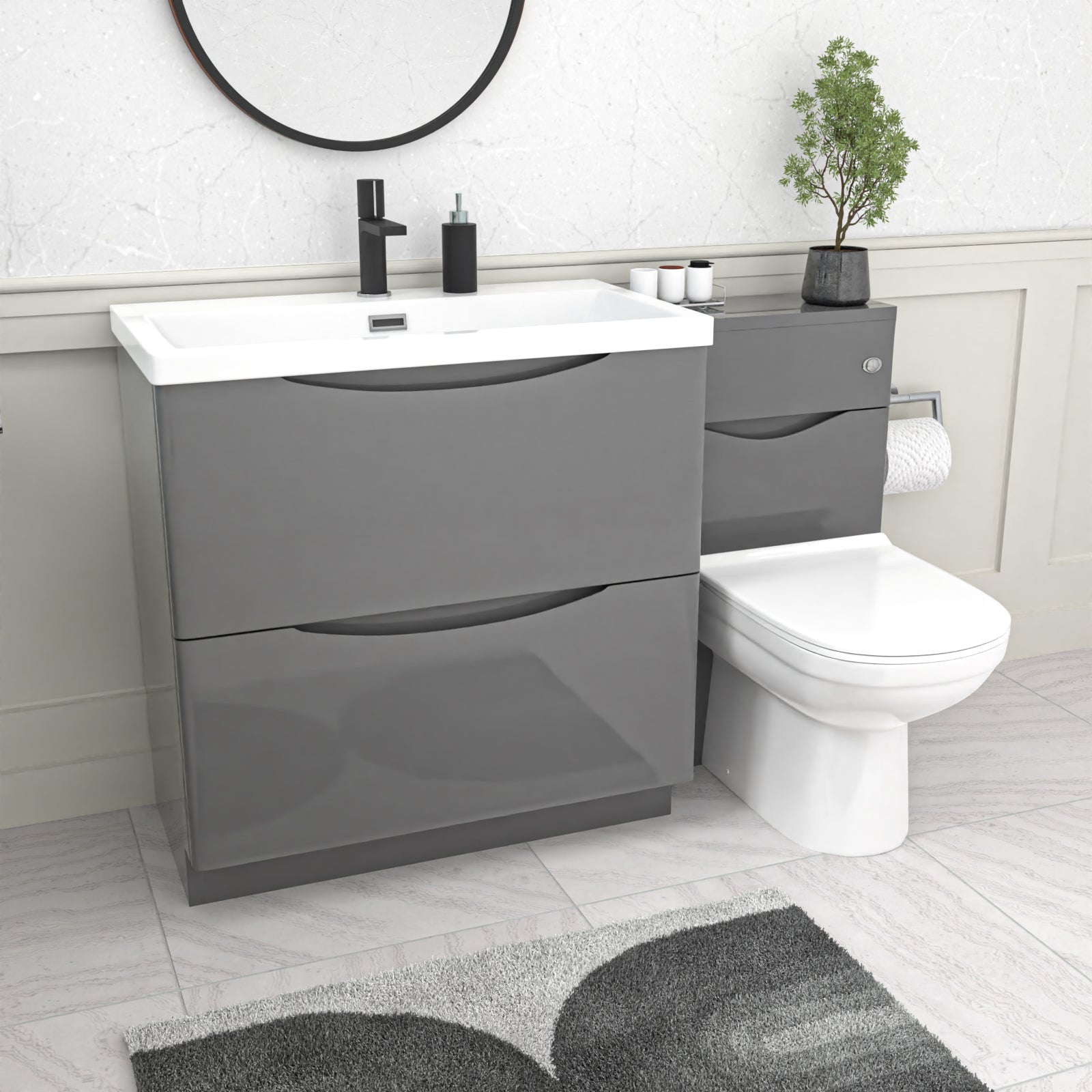 bathroom setup with Gray vanity unit, basin and a white toilet