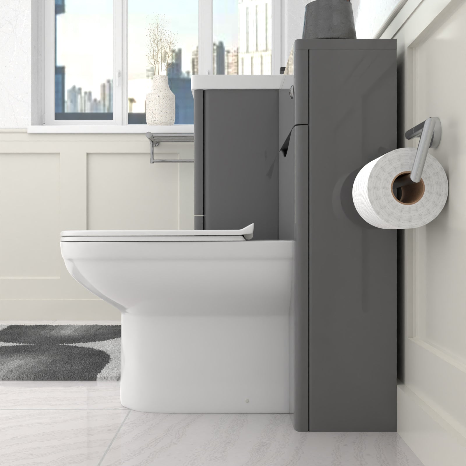 bathroom with grey wall mounted vanity sink and a toilet