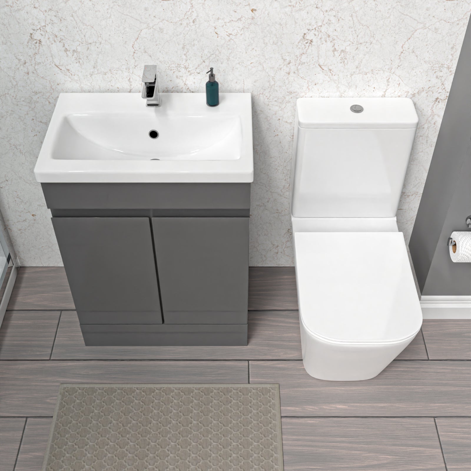 Bathroom setup with gray vanity, white sink, and toilet 