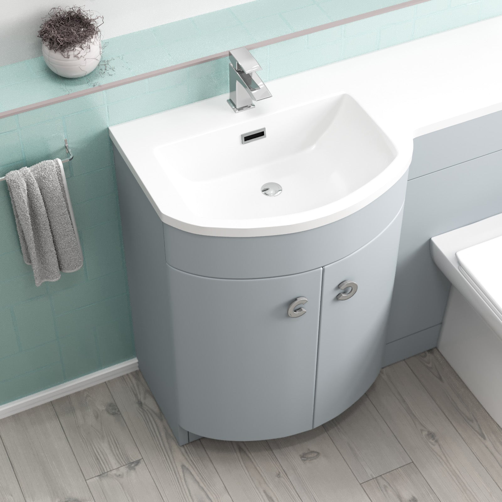 Bathroom setup with a corner vanity unit, sink, and toilet.
