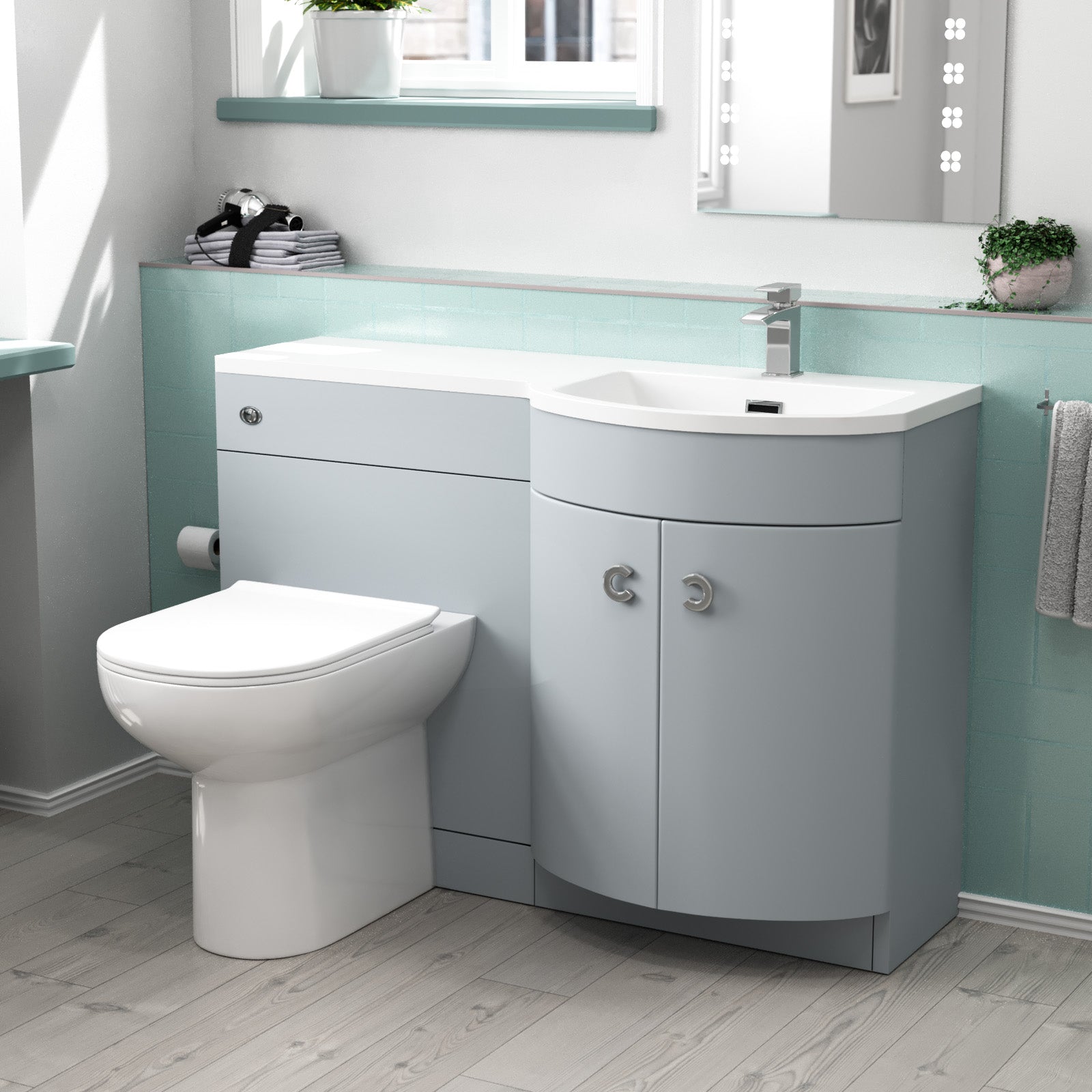 Bathroom setup with a toilet and sink vanity unit 